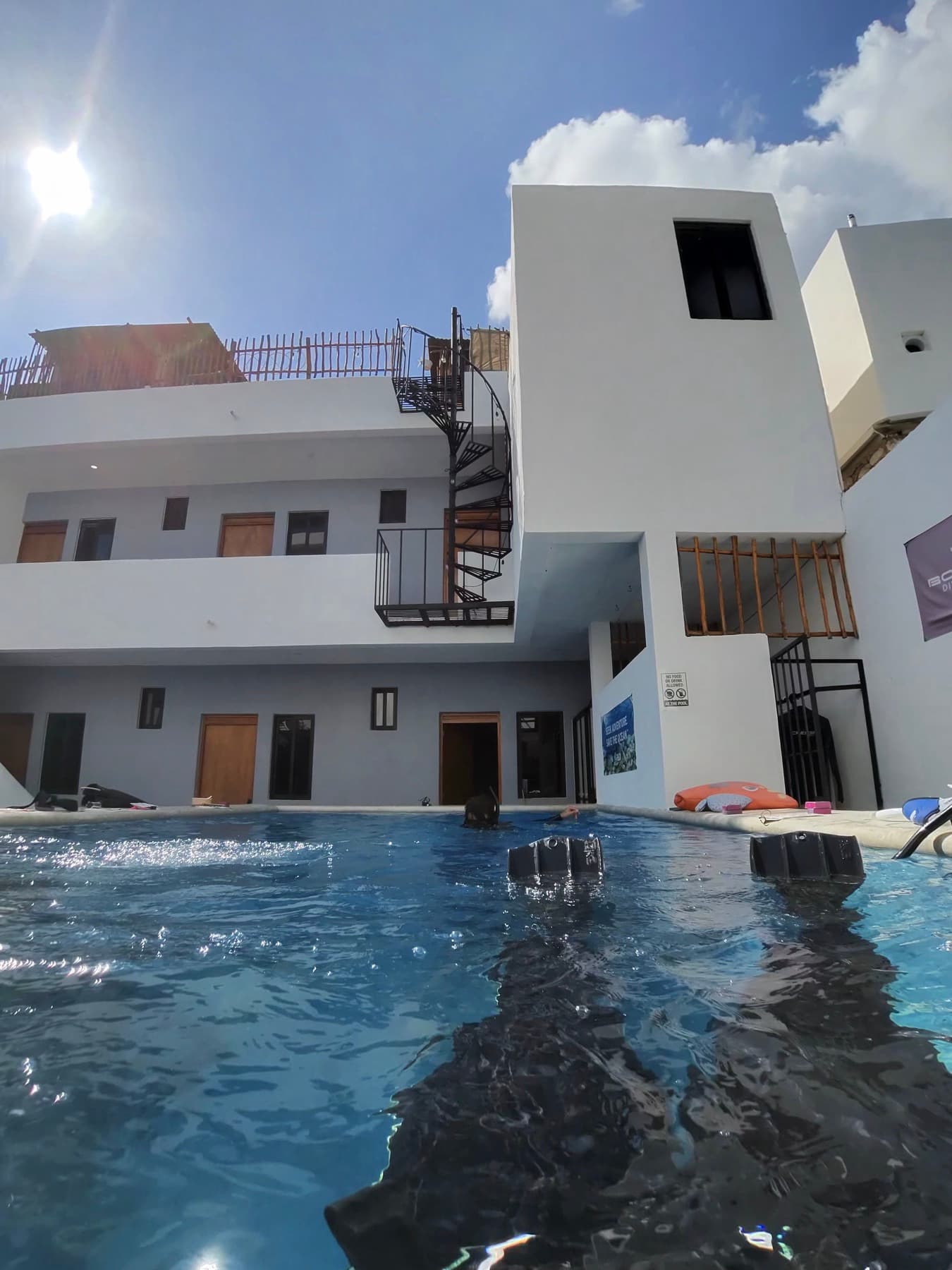 Divers practicing in a hotel pool